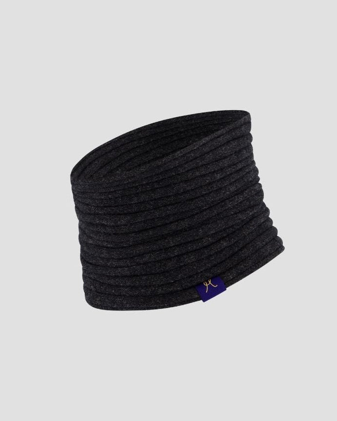 Black headband with a brand logo on a light gray background