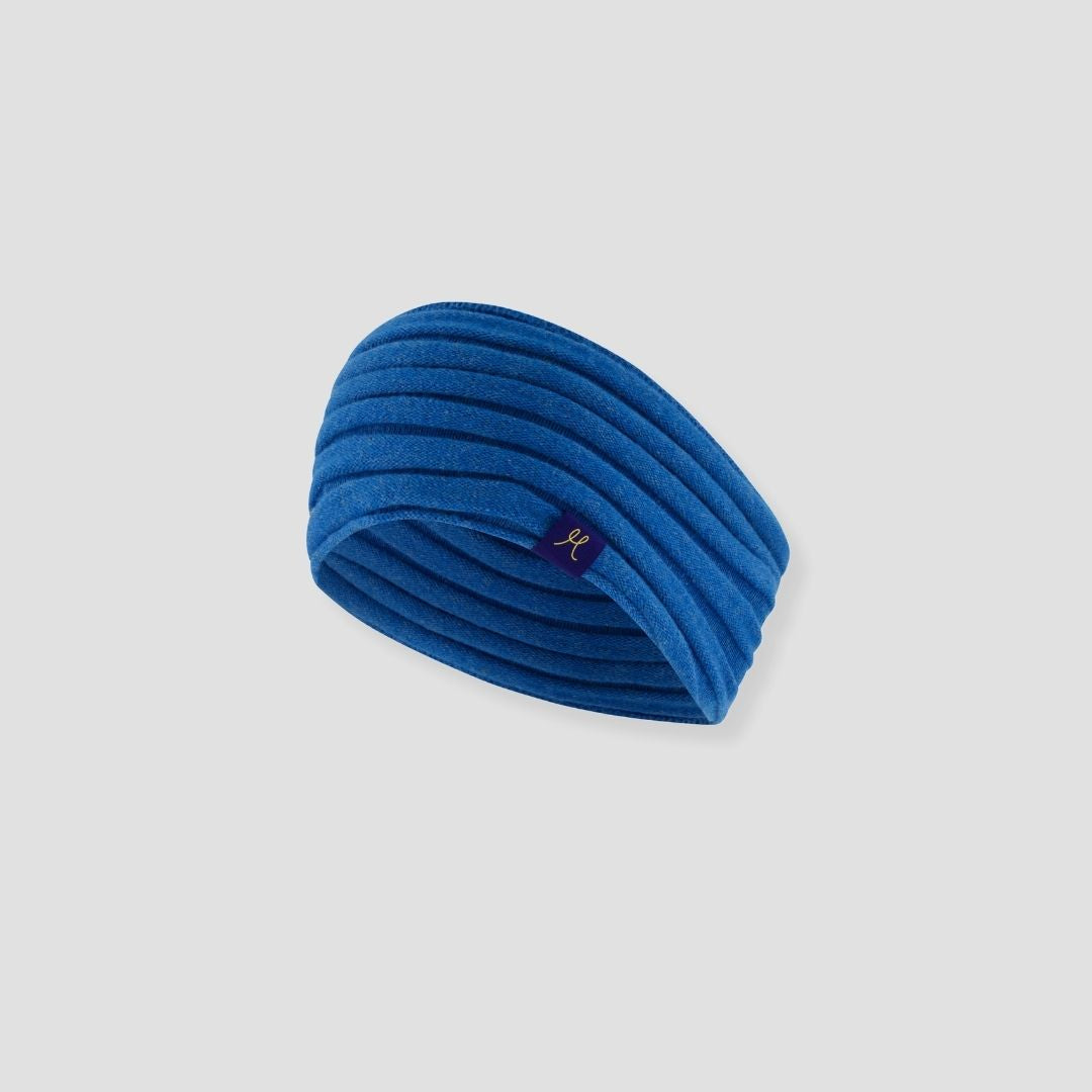 Blue headband with a brand logo on a light gray background