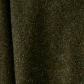Woman wearing a green poncho over a white shirt on a light gray background