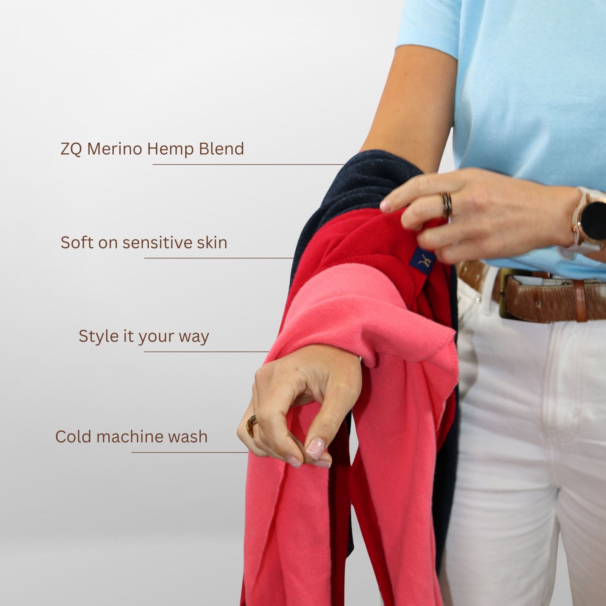 Person holding a red garment with text about ZQ Merino Hemp Blend on a white background